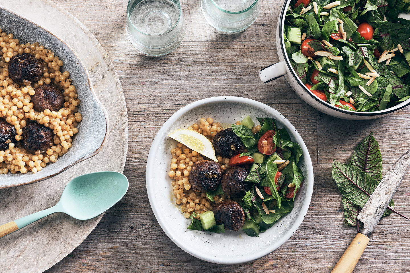 Hero image for One-pan venison meatballs with Israeli couscous and salad