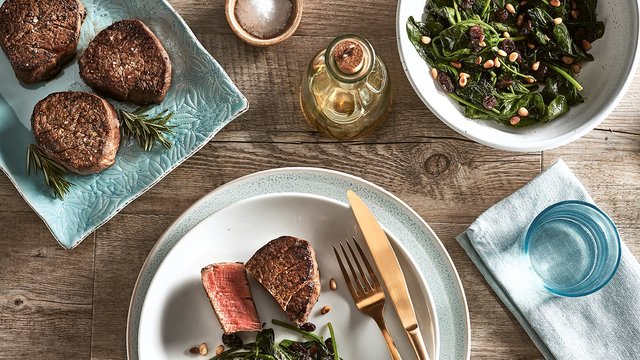 Teaser image for Reverse-seared Wagyu filet with buttered spinach, pine nuts and raisins